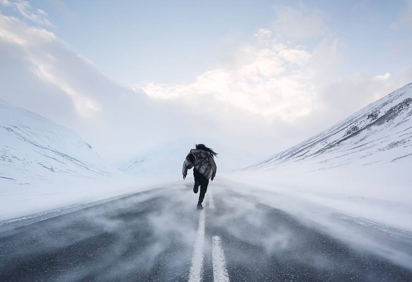 Man hiking in the snow taken by Jarrad Seng