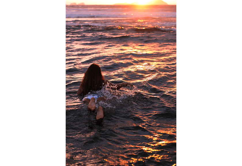 Photograph of girl in water at beach taken using RF 50mm f/1.2 L USM