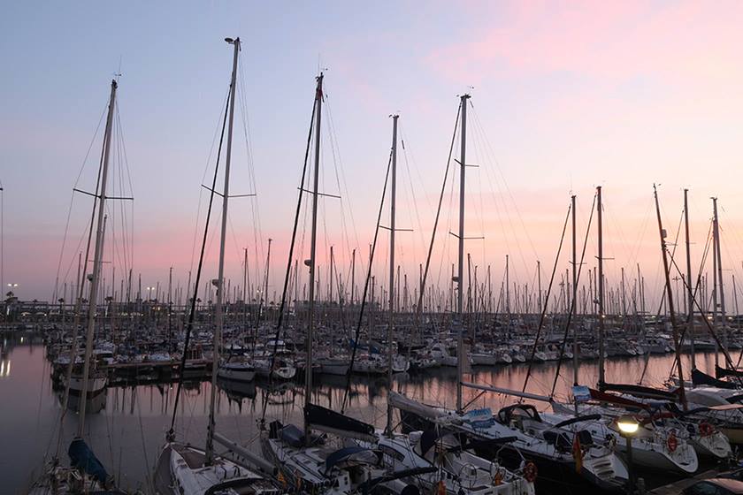 Photo of many boats docked in harbour at dusk shot on PowerShot G7X Mark II