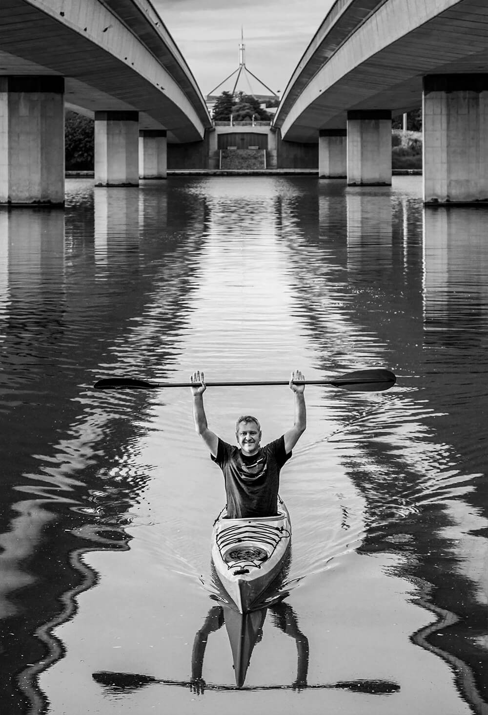 Black and white image of Paul Jurak on kayak