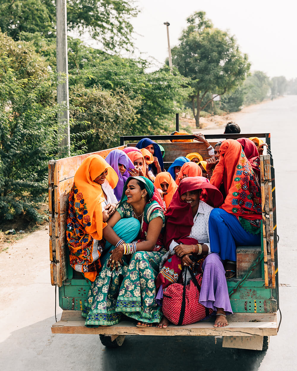 A group of Indian women on the back of a truck. Shot by Melissa Findley