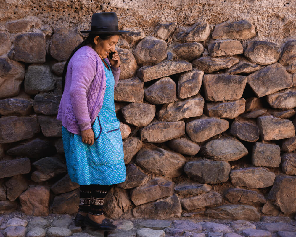 A Peruvian lady walking near the Sacred Valley in Peru. Photo by Jordan Hammond