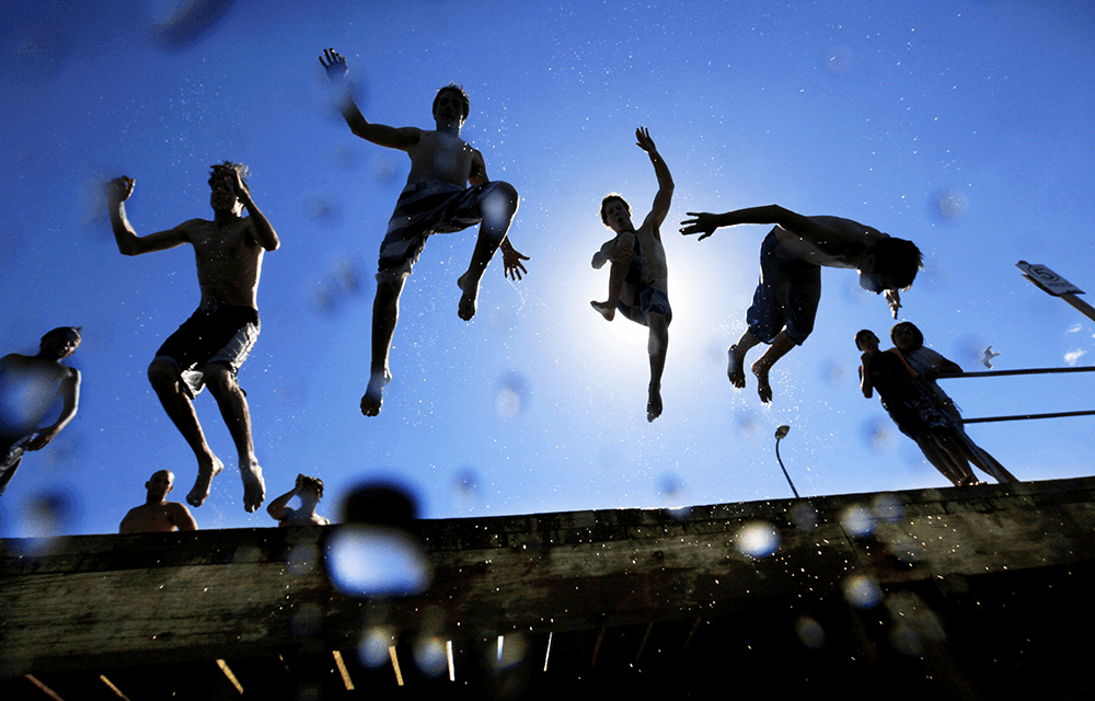 Locals in Sandringham jump off the pier taken by Alex Coppel
