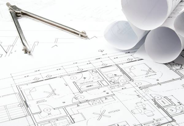Floorplans at a drafting table