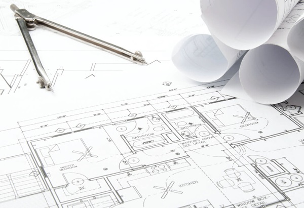 Floorplans at a drafting table