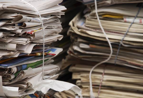 Stacks of newspaper and paper