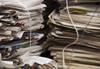 Stacks of newspaper and paper