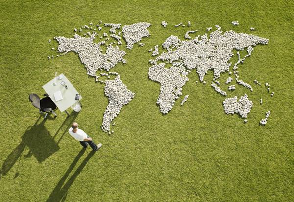 Grass with pebbles shaped as the world map