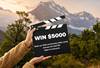Video competition clapperboard in front of mountains