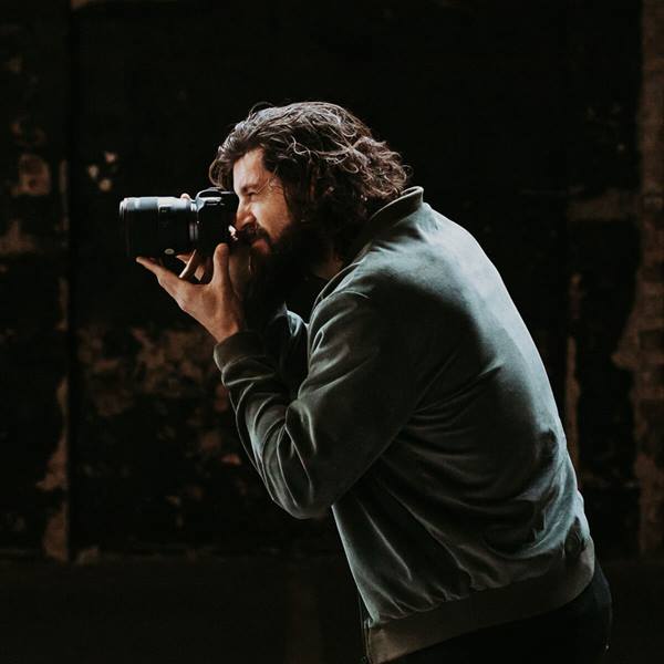 James Simmons taking a photo using a Canon EOS Camera