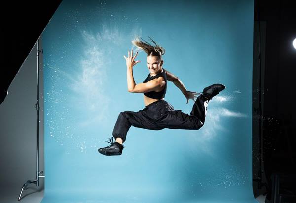Image of a dancer posing in mid air