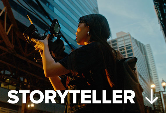 Image of a Storyteller using an EOS camera out in the streets at night