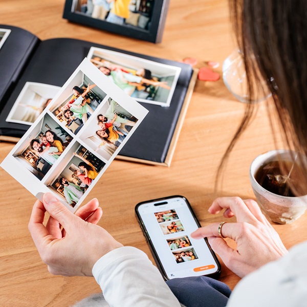 Image of a woman using the Canon print app to print photos