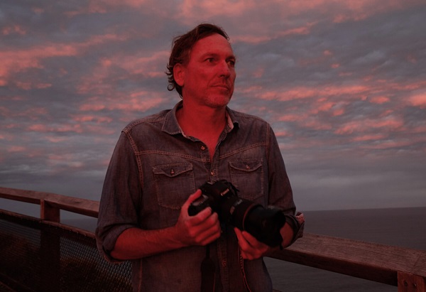 Image of Canon Master Paul Blackmore holding a Canon EOS camera