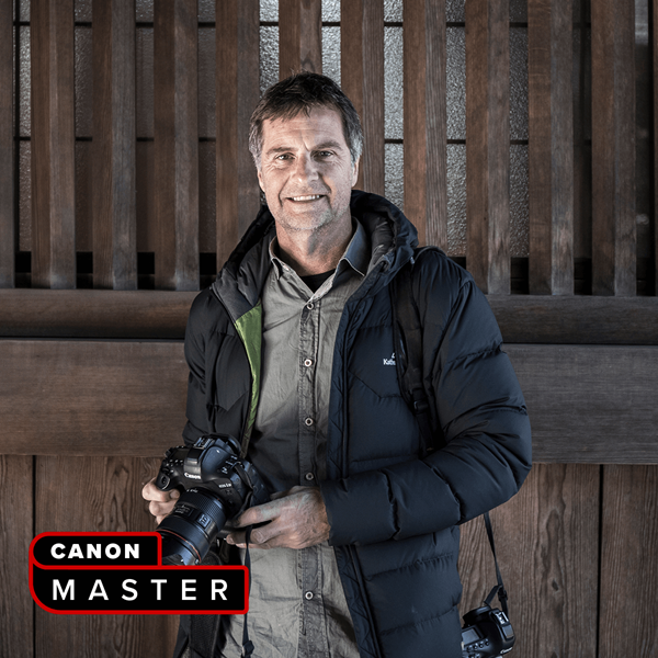 Image of Canon Master Richard I'Anson holding a Canon EOS camera