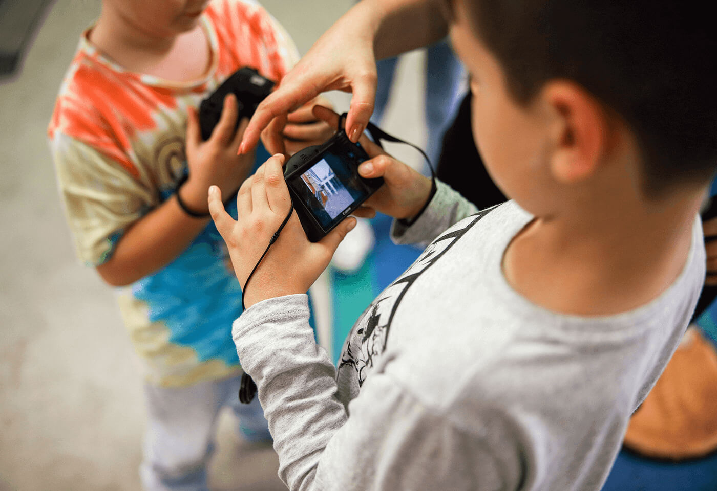 Kids using Canon EOS cameras
