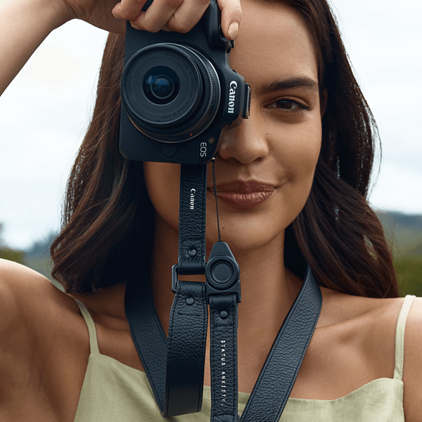 Model using the Canon EOS R50 with the Status Anxiety leather strap photographed by Leni Ali Studios