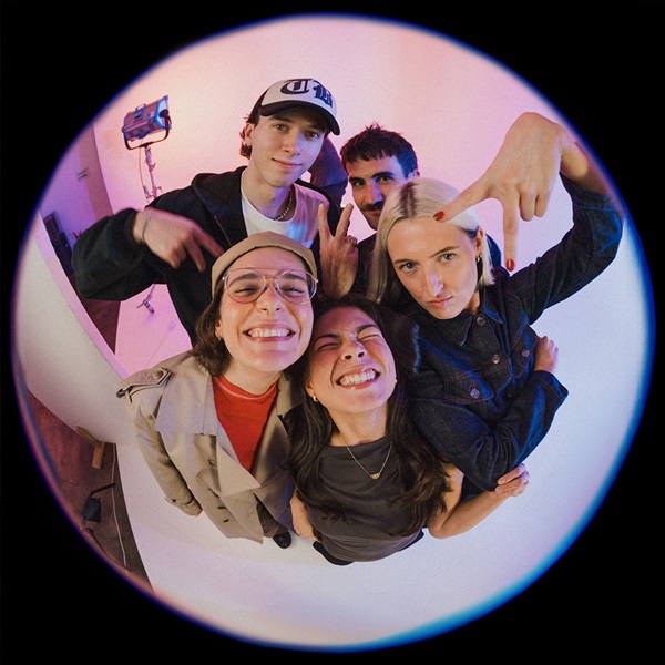 Group image of The Circle mentors on a studio with pink and purple background taken using a fish eye lens