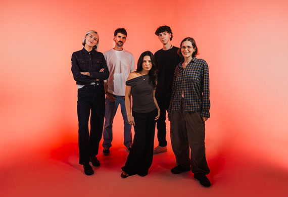 Group image of The Circle mentors on a studio with orange and red background