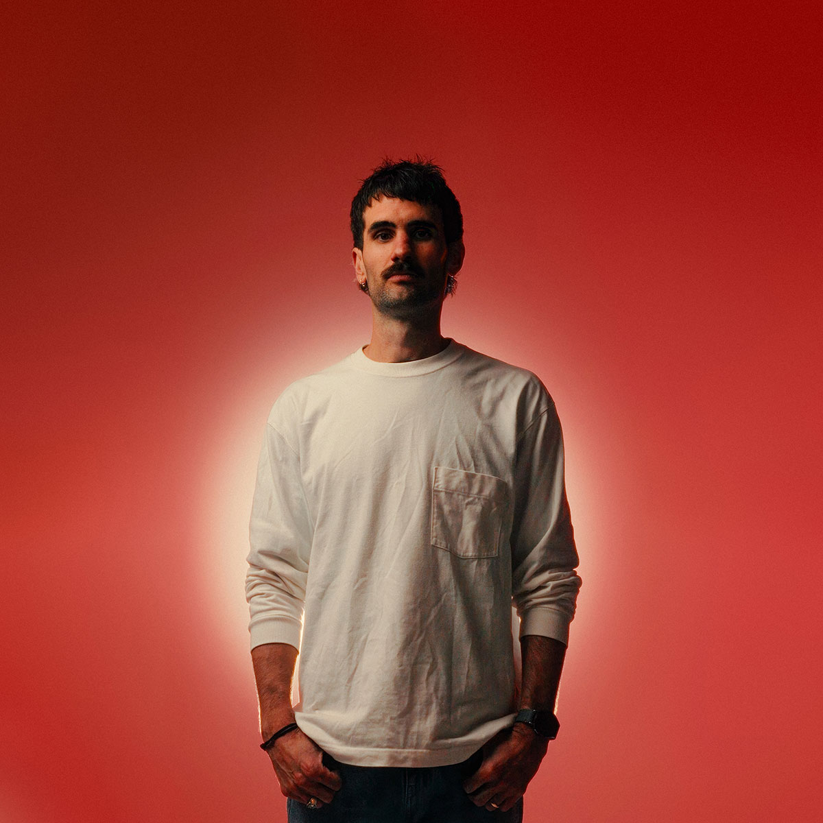Image of The Circle mentor TK North on a studio with red background