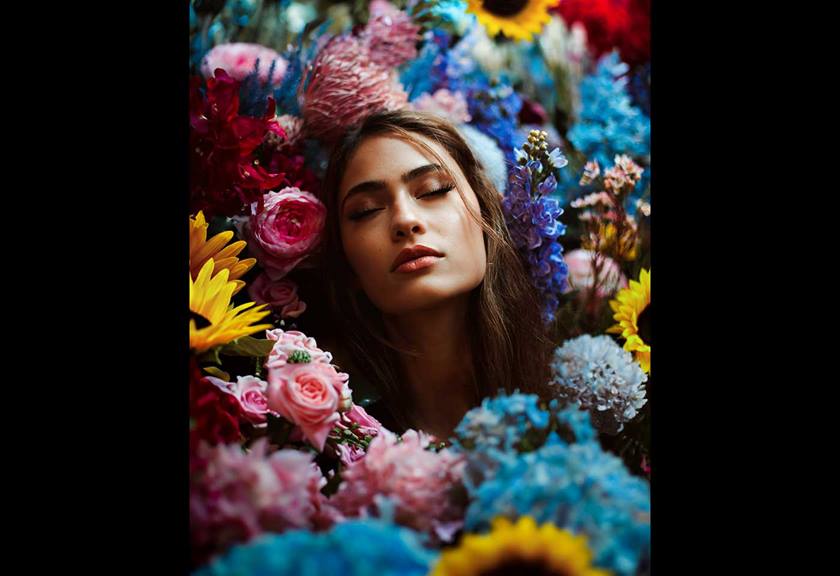Image of woman surrounded by flowers shot by Canon Ambassador Wil Calabio