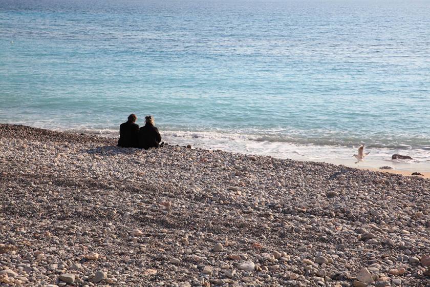Couple on beach shore taken using EF 24-70mm f/2.8L II USM
