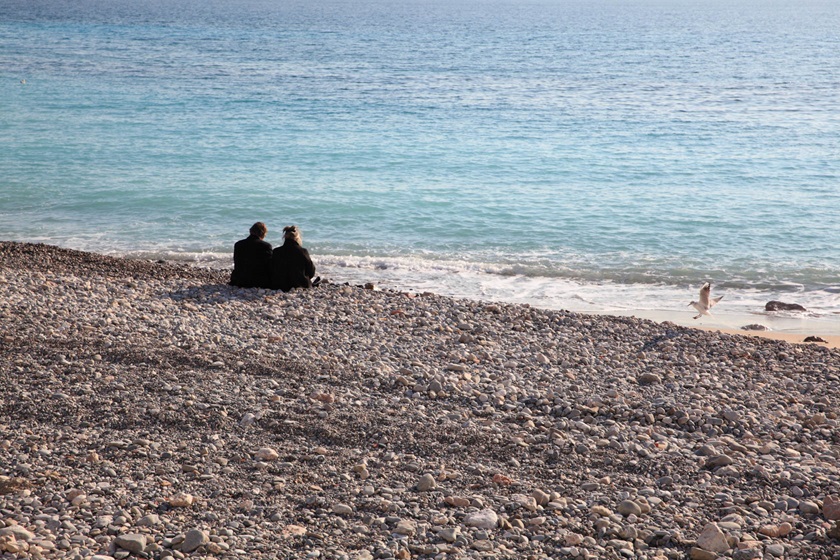 Couple on beach shore taken using EF 24-70mm f/2.8L II USM