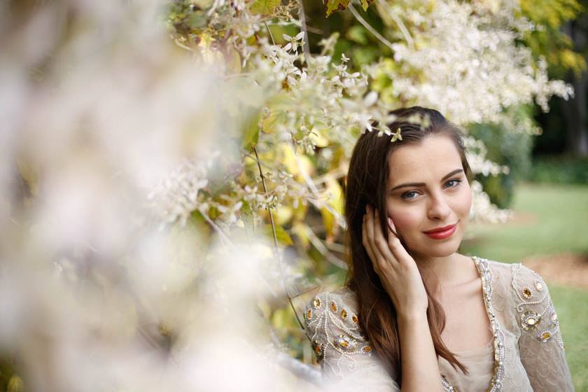 Image of model among flowers taken using EF 50mm f/1.8 STM