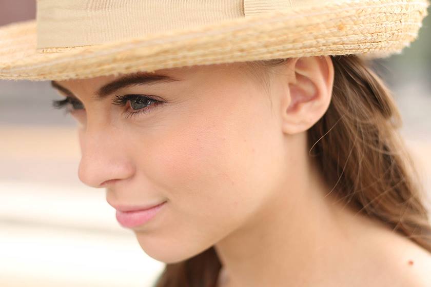 Up close shot of model with hat taken using EF 50mm f/1.8 STM
