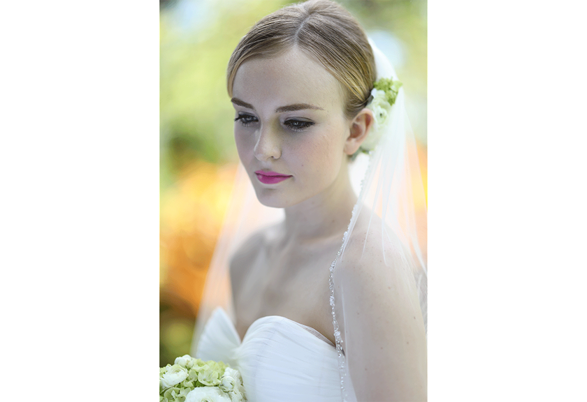 Portrait image of bride looking down