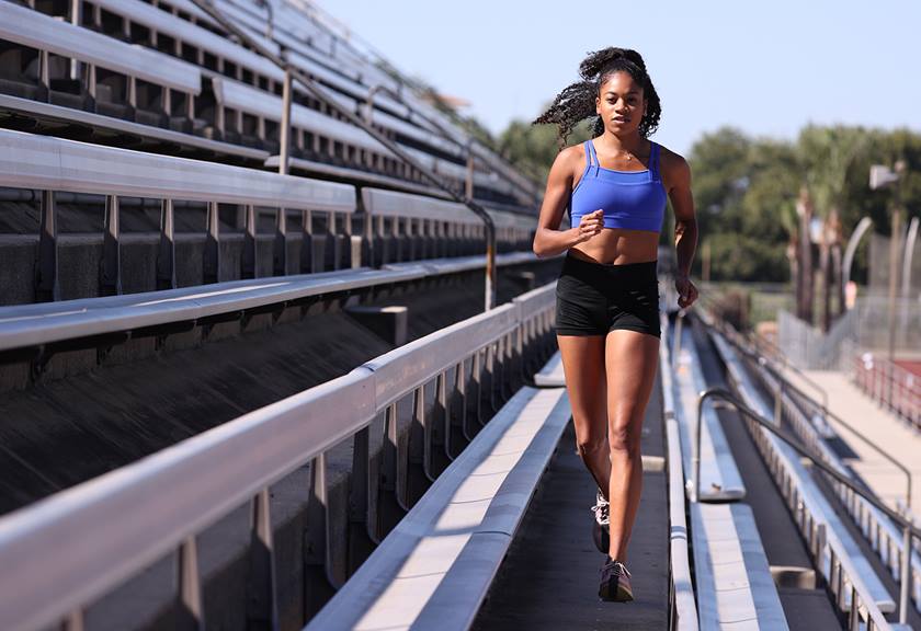 Runner in the bleachers taken with EOS 1D X Mark III