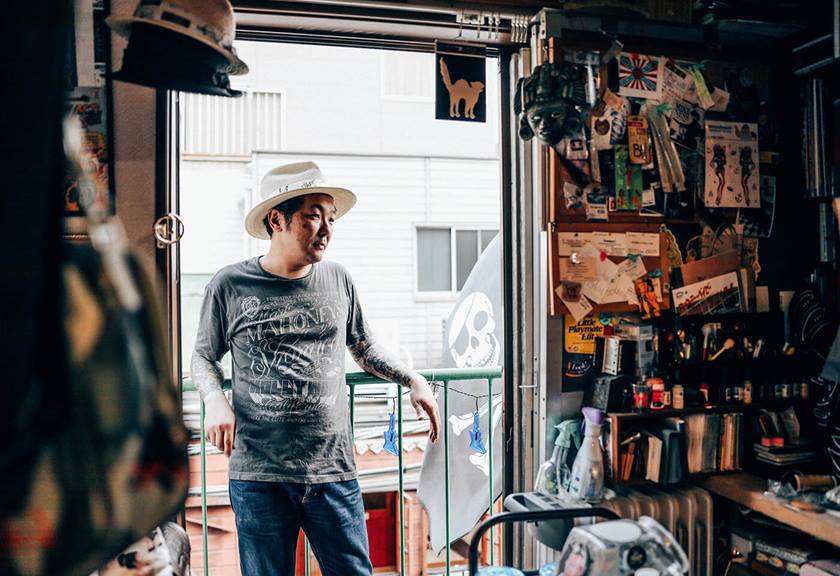 Photograph of man outside tattoo shop taken using RF 28-70mm f/2L USM