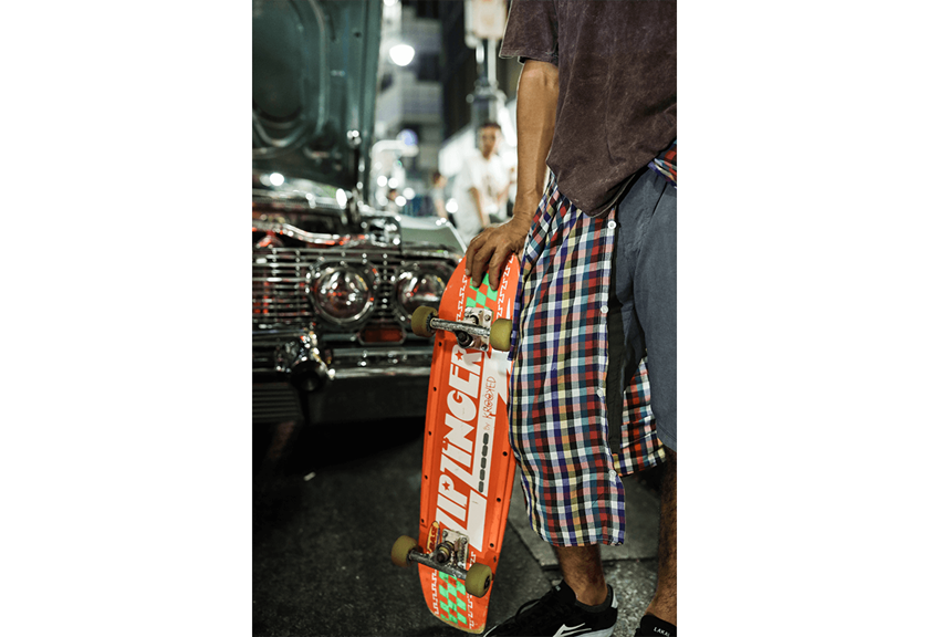 Photograph of man holding skateboard taken using RF 28-70mm f/2L USM
