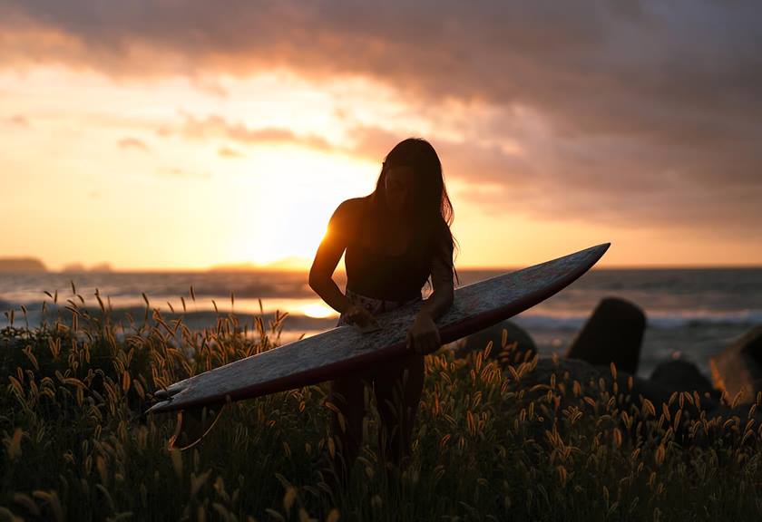 Photograph of girl with surfboard at sunset using RF 50mm f/1.2 L USM