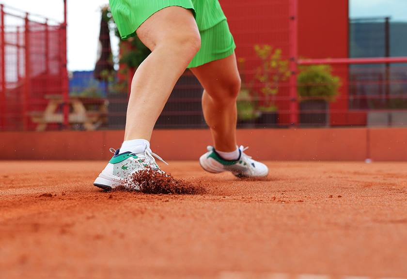 Close up image of a tennisn player's legs in action