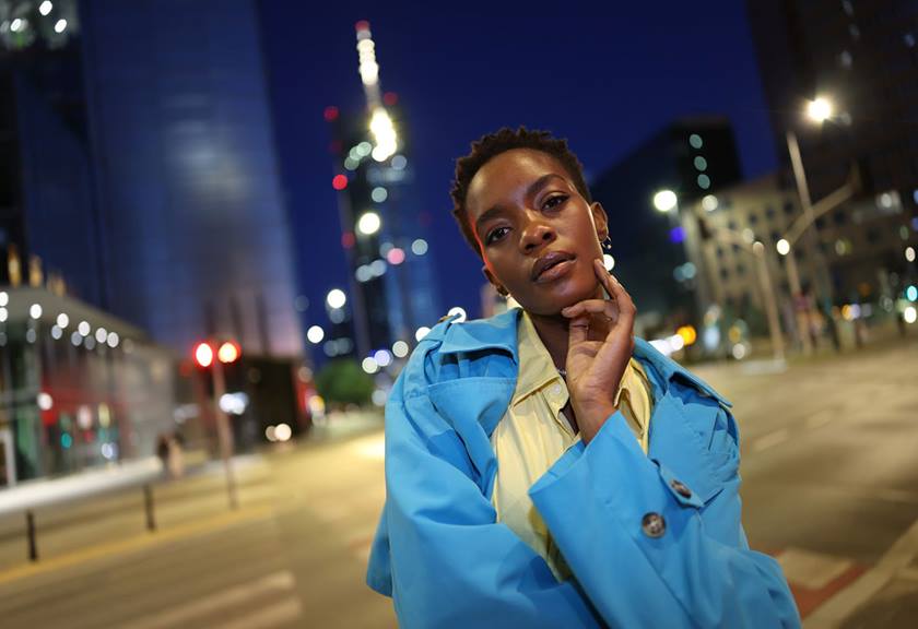 Image of a woman in night life captured with RF 24mm f/1.4L VCM lens