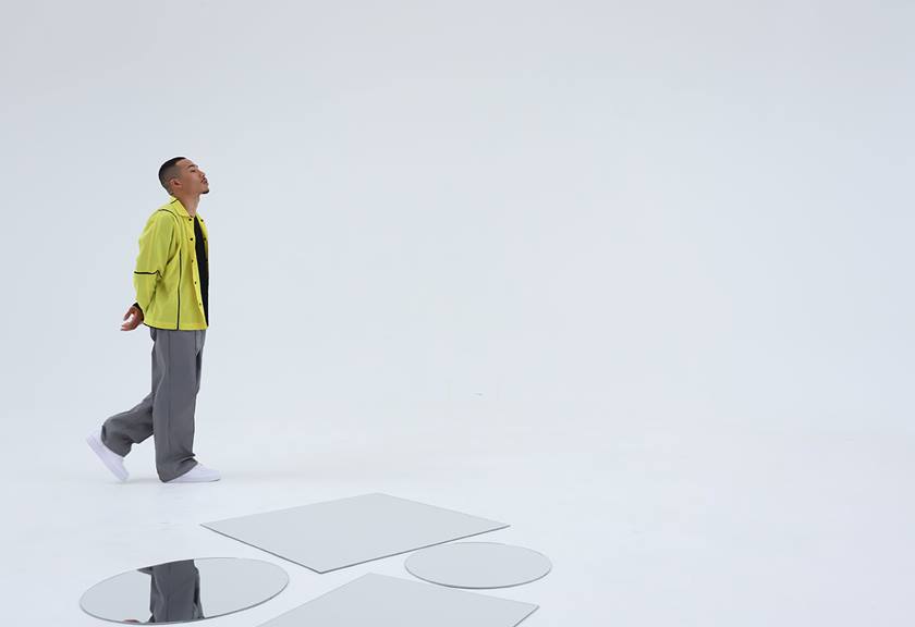 Image of a man walking around with mirrors on the floor taken using the RF-S 14-30mm f/4-6.3 IS STM PZ standard zoom lens