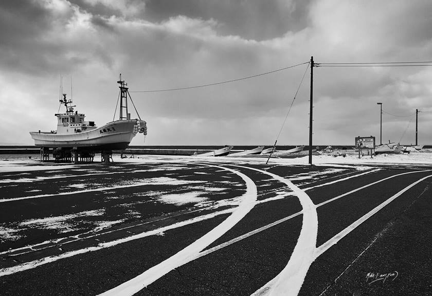 Black and white image of a boat on land by Canon Master Mike Langford