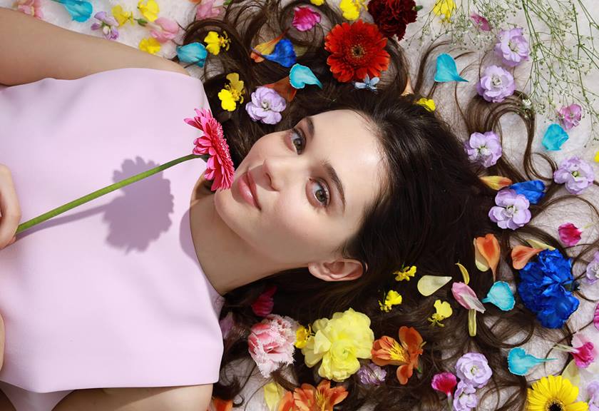 Model laying on flowers taken with RF 24-105mm f/4-7.1 IS STM