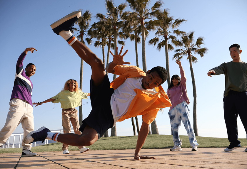 Image of friends breakdancing taken using RF-S 18-45mm f/4.5-6.3 IS STM standard zoom lens