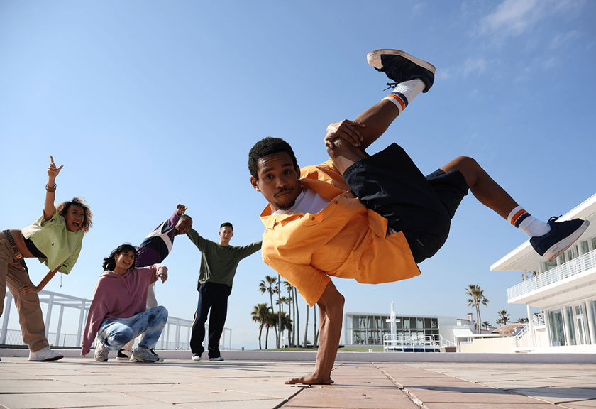 Image of model breakdancing with friends taken using RF-S 18-45mm f/4.5-6.3 IS STM standard zoom lens