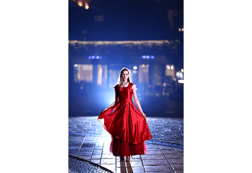 Image of model in red dress taken using Canon EOS and Speedlite EL-1