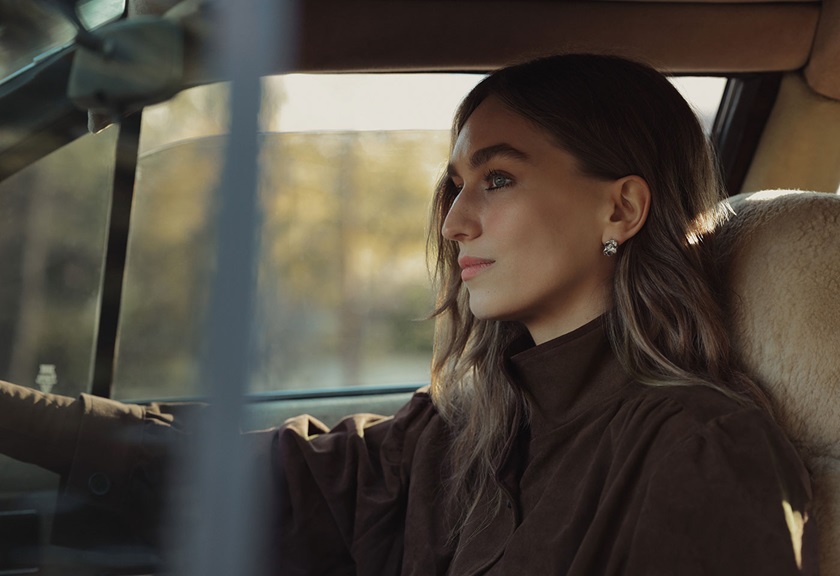 Image of a woman driving her car looking ahead taken by Steven Chee