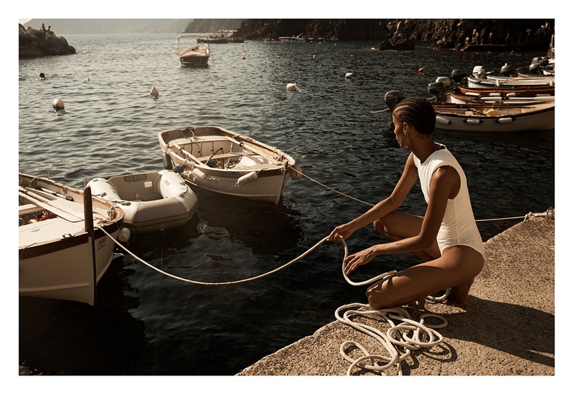 Fashion photography image of a woman docking a boat by MACAMI