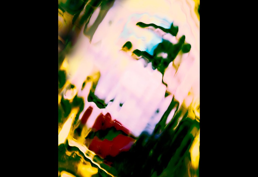 Distorted fashion photography image of a woman with red lips and blue eyeshadow by MACAMI