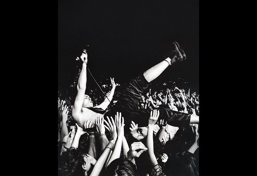 Image of a band vocalist doing a stage dive taken by FRMEFEST 2025 creator Darcy Goss