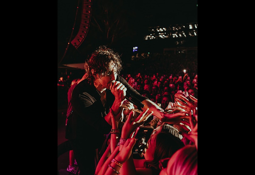 Image of a male performer touching the crowd taken by FRMEFEST 2025 creator Darcy Goss