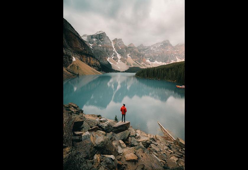 Image of a traveller admiring the lake and snowy mountains taken by FRMEFEST 2025 creator TK North