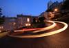 Image of a light trail left by a car on a winding road at night taken with the Canon EF 11-24mm f4L USM wide zoom lens