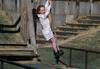 Girl on rope swing taken with Canon EF-M 55-200 IS STM lens